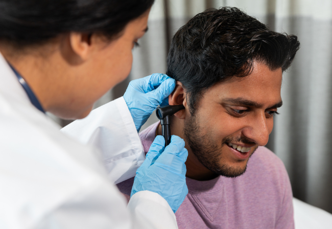 ENT Doctor with Otoscope cnv